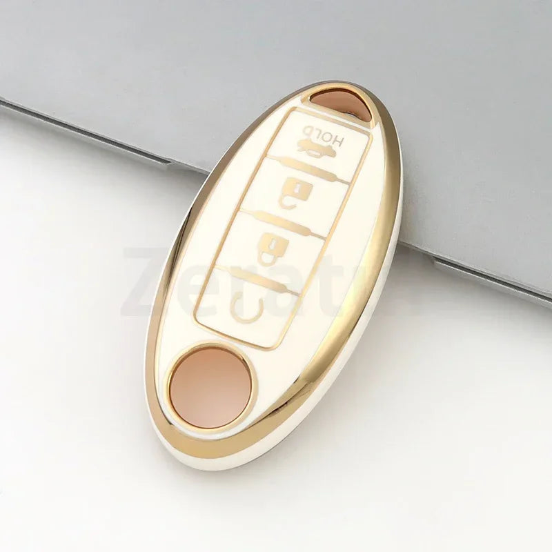 A gold and white TPU car key case cover for Nissan and Infiniti models.