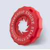 A red, hexagonal engine start/stop button cover with a decorative trim.