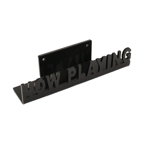 Black wall-mounted vinyl record display shelf with the words HOW PLAYING engraved on it.