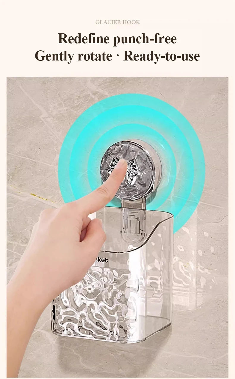 A hand rotates a clear wall-mounted suction cup storage basket with a water ripple design.