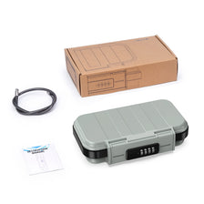 A portable 4-digit combination safe lock box in gray plastic with a steel cable and its cardboard packaging.
