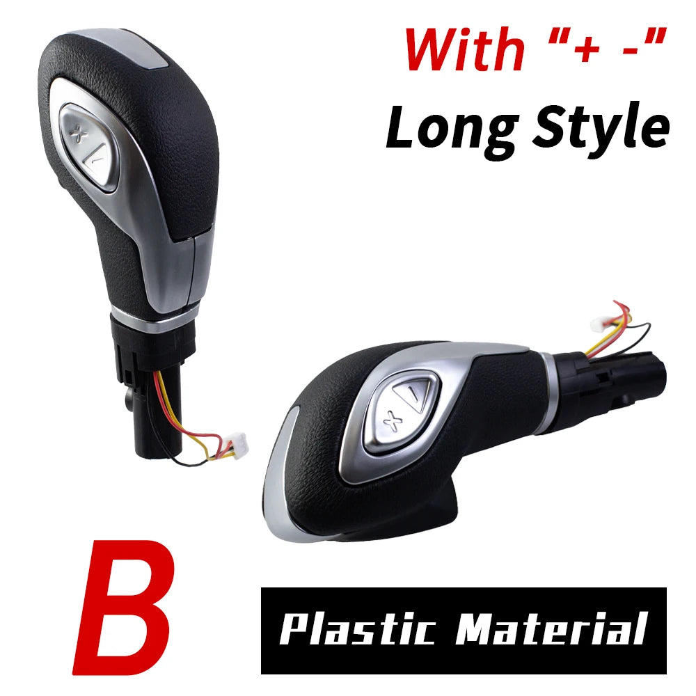 A black gear shift knob with a silver accent and long style, made of plastic material.
