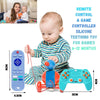 A baby is holding a silicone remote control and game controller toy for teething, shown next to the electronic device.
