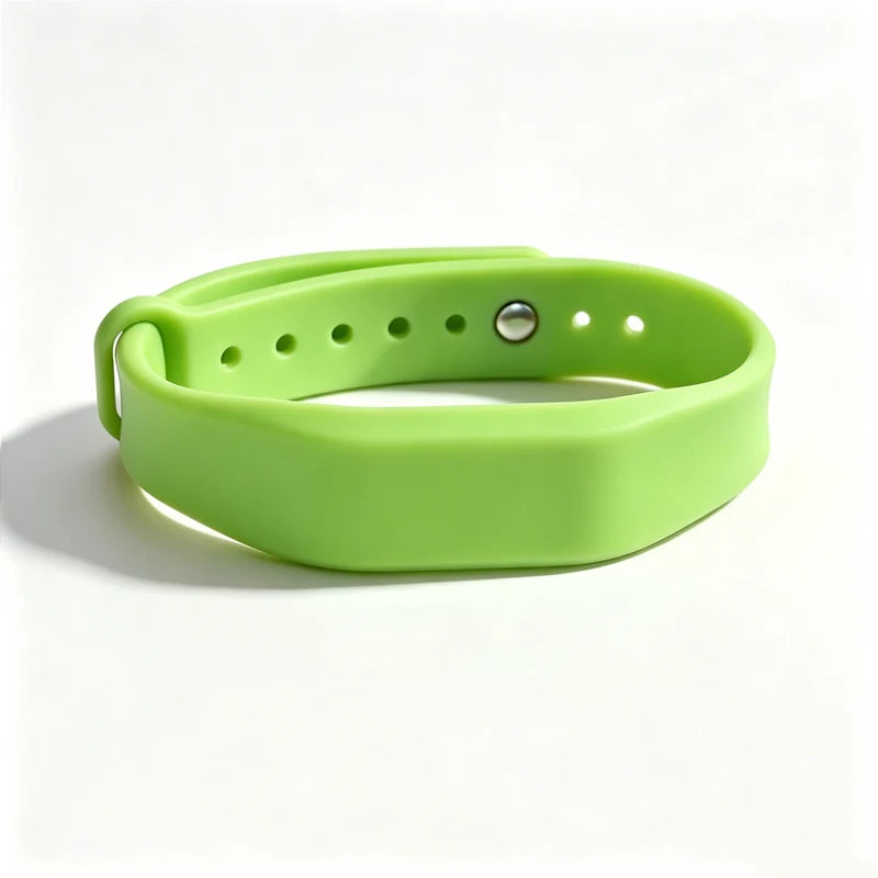 A lime green silicone wristband with a silver clasp and multiple holes for access control.