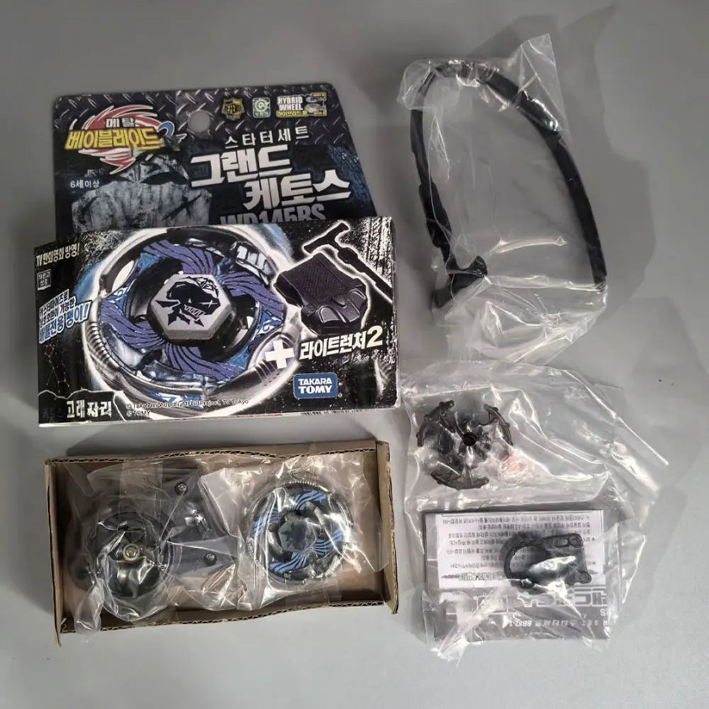 A collection of premium metal spinning tops and related accessories packaged in boxes and plastic bags.