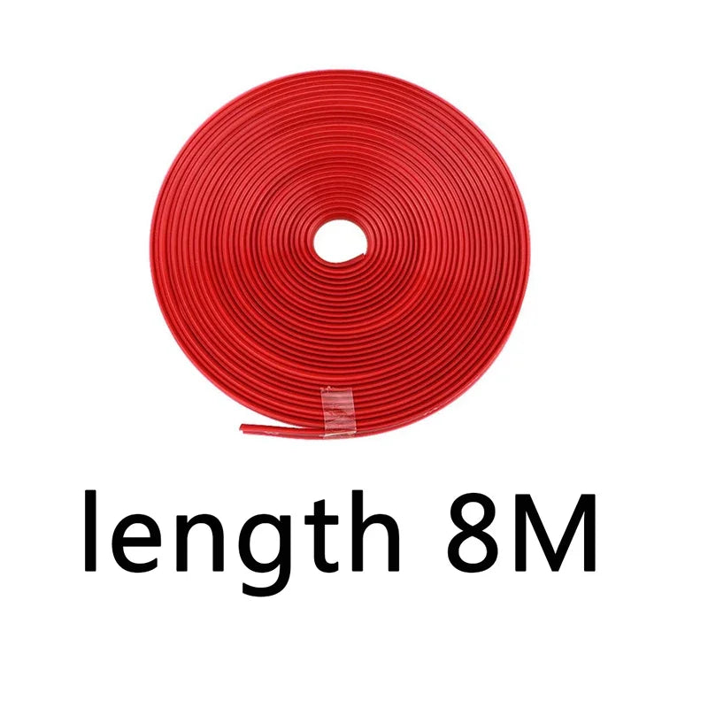 A roll of red car wheel rim protector trim with a central hole.