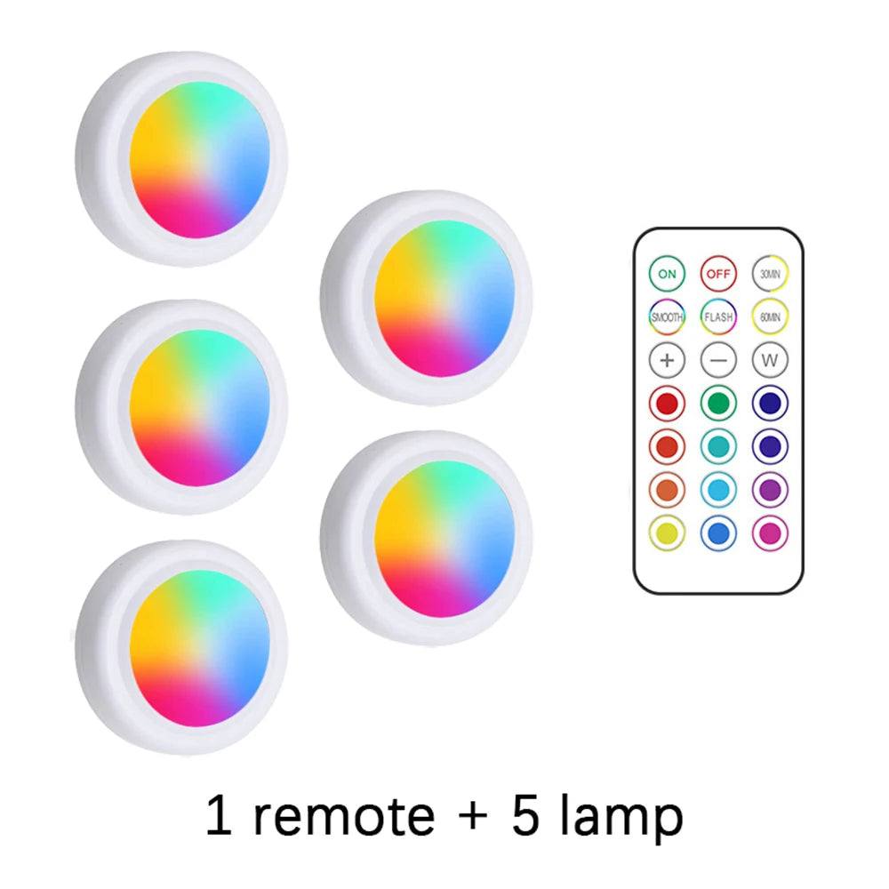 Five color light bulbs and one remote control for an RGB LED under cabinet light system