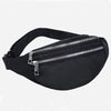 Black nylon waist pack with a zipper and adjustable strap