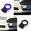 A close-up view of a blue and black sporty trailer hook decorative accent for a car grille.