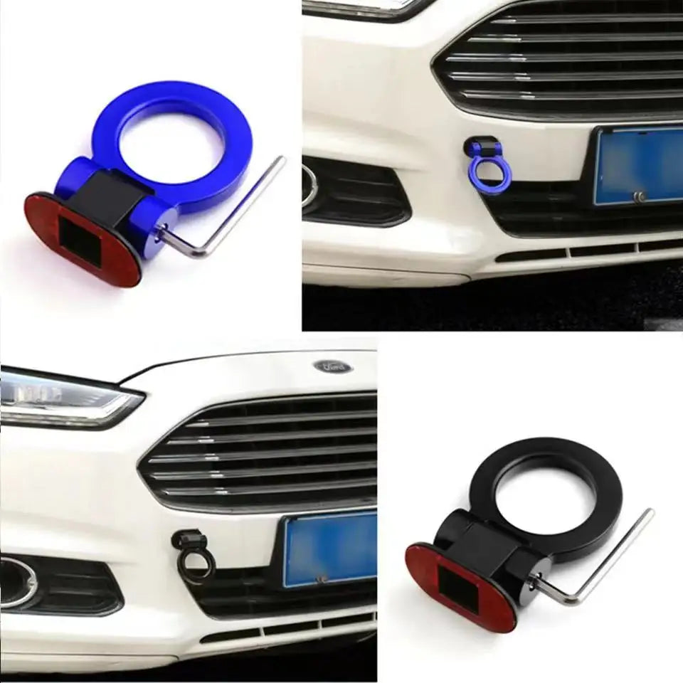 A close-up view of a blue and black sporty trailer hook decorative accent for a car grille.