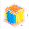 A transparent cube puzzle made of interlocking plastic maze pieces in orange, yellow, and blue colors.