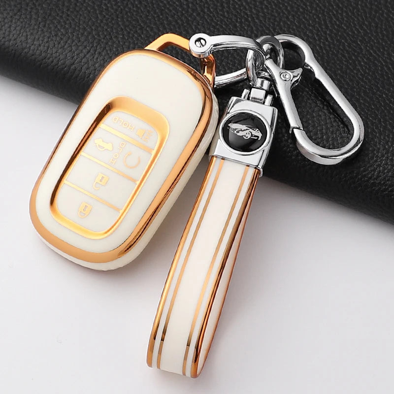 A white TPU protective case for a Honda key fob, featuring a gold trim and attached to a silver keychain.