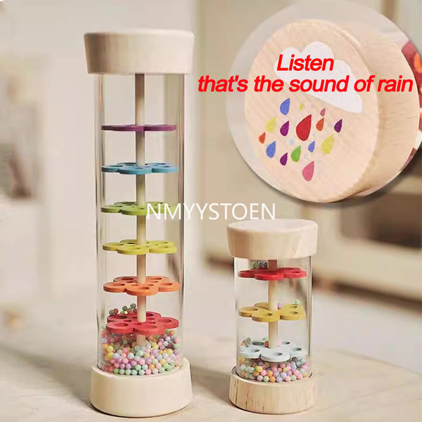 A wooden rain sound pipe toy with colored beads inside, demonstrating the sound of rain.
