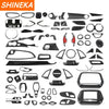 A collection of carbon fiber interior trim pieces for a Chevrolet Camaro, including various panels and accents.