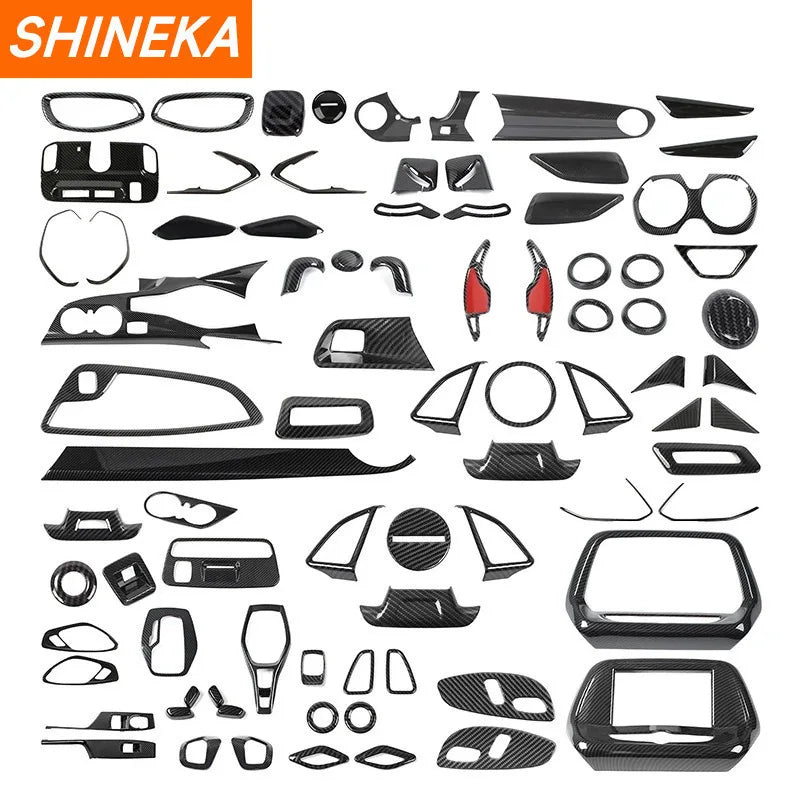 A collection of carbon fiber interior trim pieces for a Chevrolet Camaro, including various panels and accents.