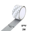 Roll of grey self-adhesive fiberglass screen repair patches, 2 meters long.