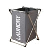 A gray foldable waterproof laundry basket with metal handles and sorting compartments.