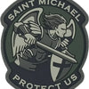 A dark green patch featuring the name Saint Michael and the text Protect Us with an archangel figure.