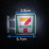 A rectangular fridge magnet featuring the number seven in red and orange on a green background with the word ELEVEN.