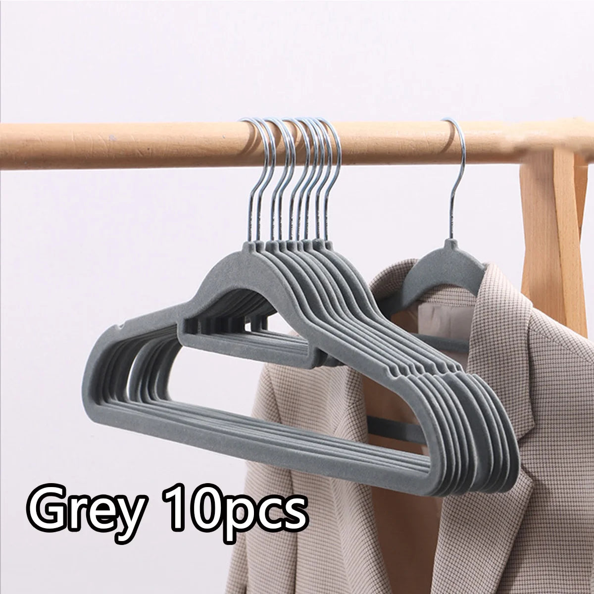 Grey non-slip velvet hangers with multiple hooks displayed on a wooden hanger.