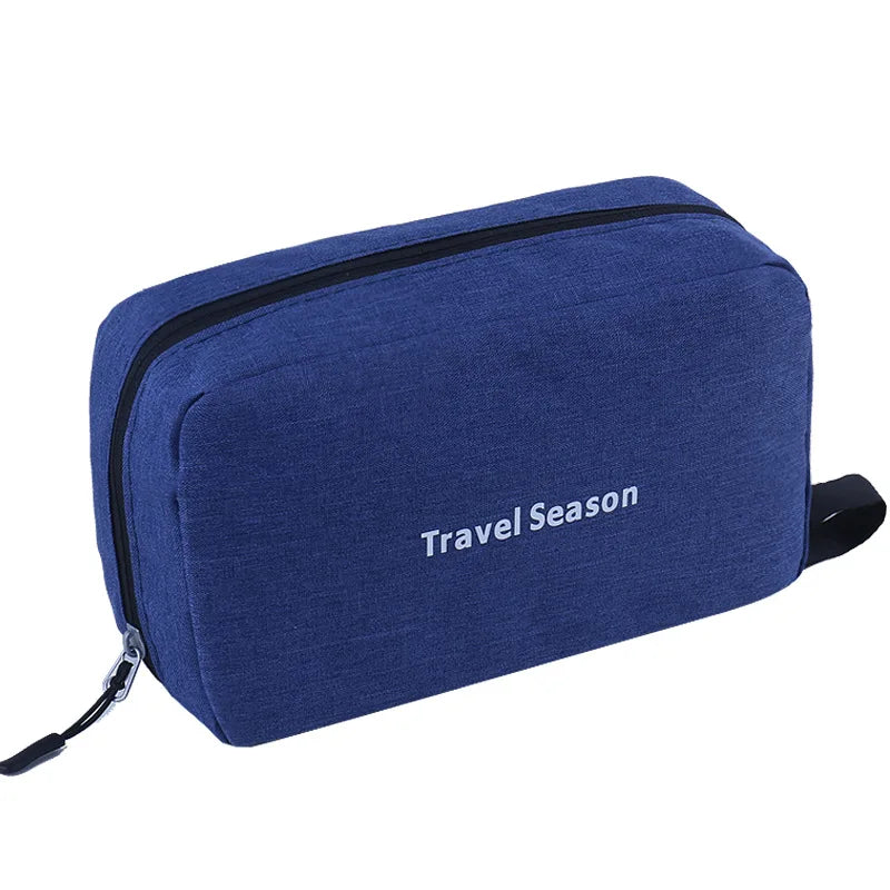A navy blue hanging travel toiletry bag with a zipper and the text Travel Season printed on it.