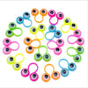 A collection of 100 colorful eye finger puppet rings for kids, featuring various bright colors and designs.