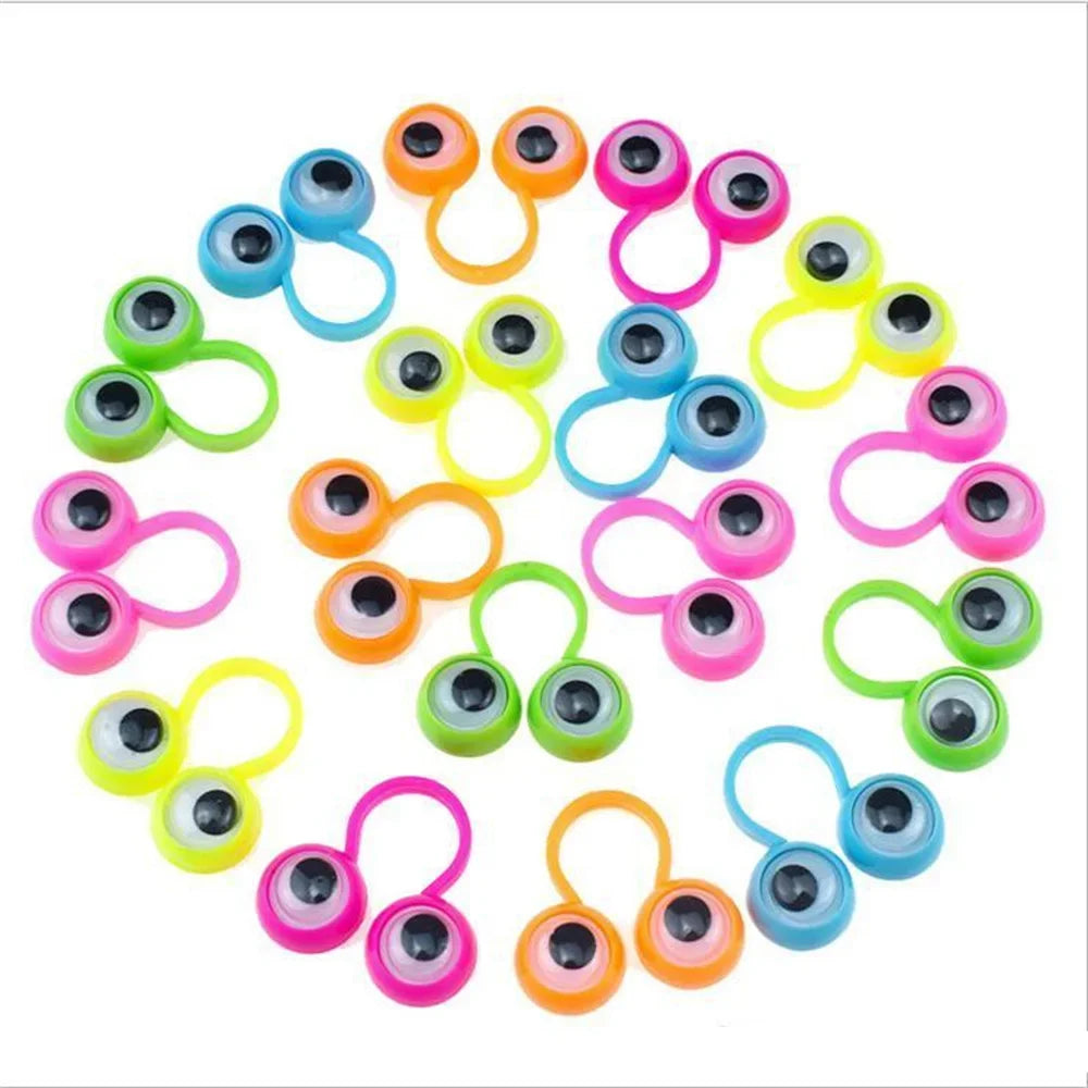 A collection of 100 colorful eye finger puppet rings for kids, featuring various bright colors and designs.