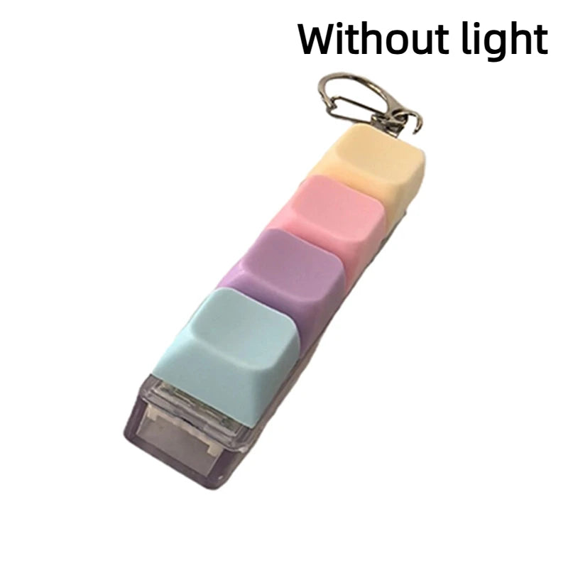 A keychain fidget toy with layered colored keycaps attached to a metal ring.