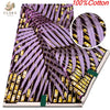 Purple and yellow striped African wax print fabric featuring a pattern of feathers and swirling motifs