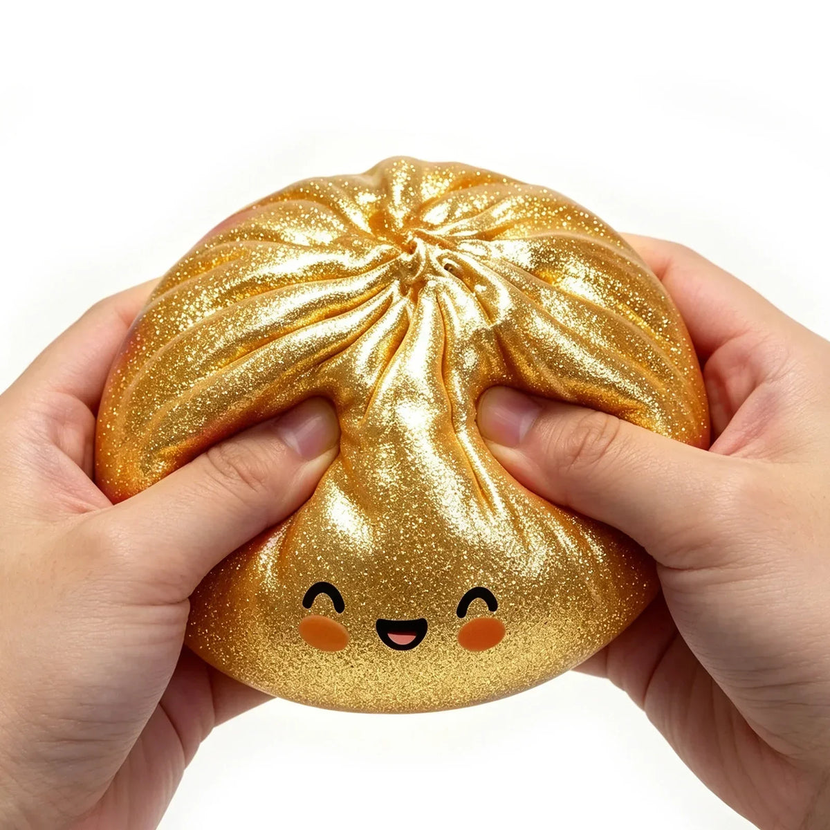 A hand holds a golden, squishy dumpling-shaped fidget toy for stress relief.