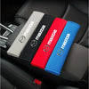 A set of five colored soft cotton car seat belt shoulder protector covers displayed in a car interior.