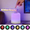 A touch-activated LED night light displays various colors, including red, green, blue, yellow, and purple.