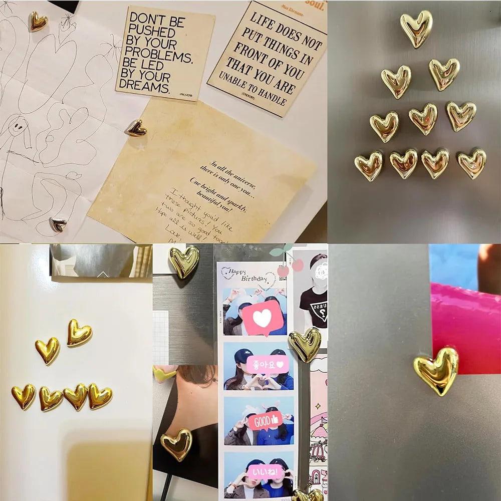A collection of twelve gold heart-shaped refrigerator magnets arranged in rows.