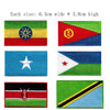 A collection of embroidered patches featuring various flags, including the Dominican Republic flag.