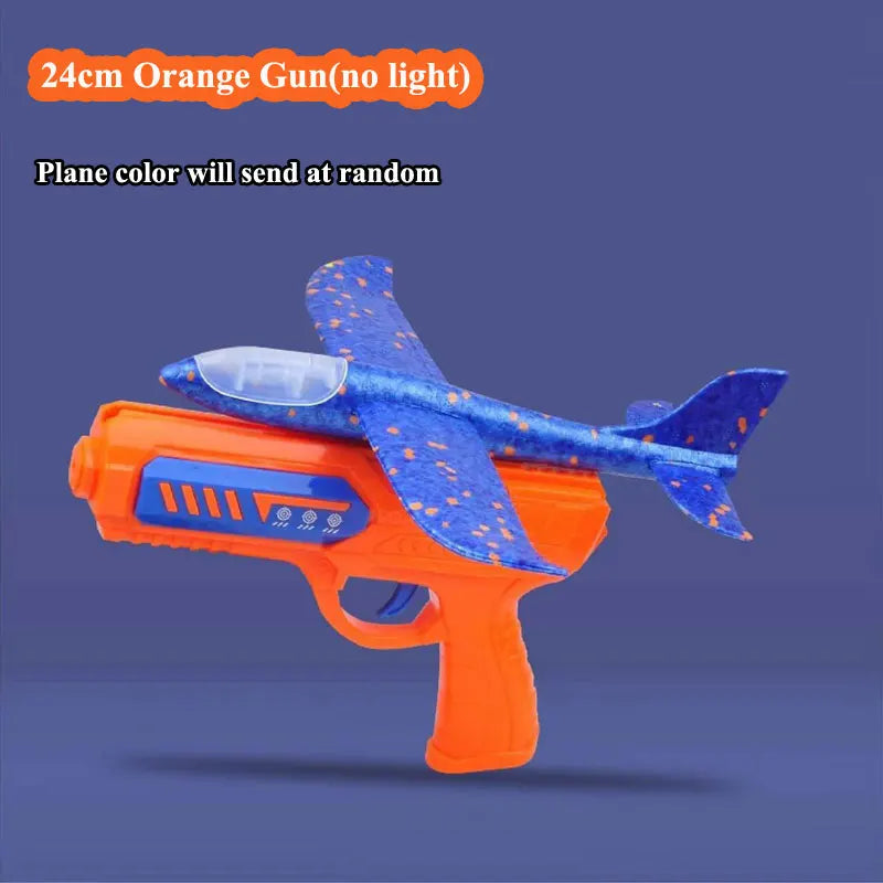 Orange foam plane launcher toy with a blue patterned wing and barrel