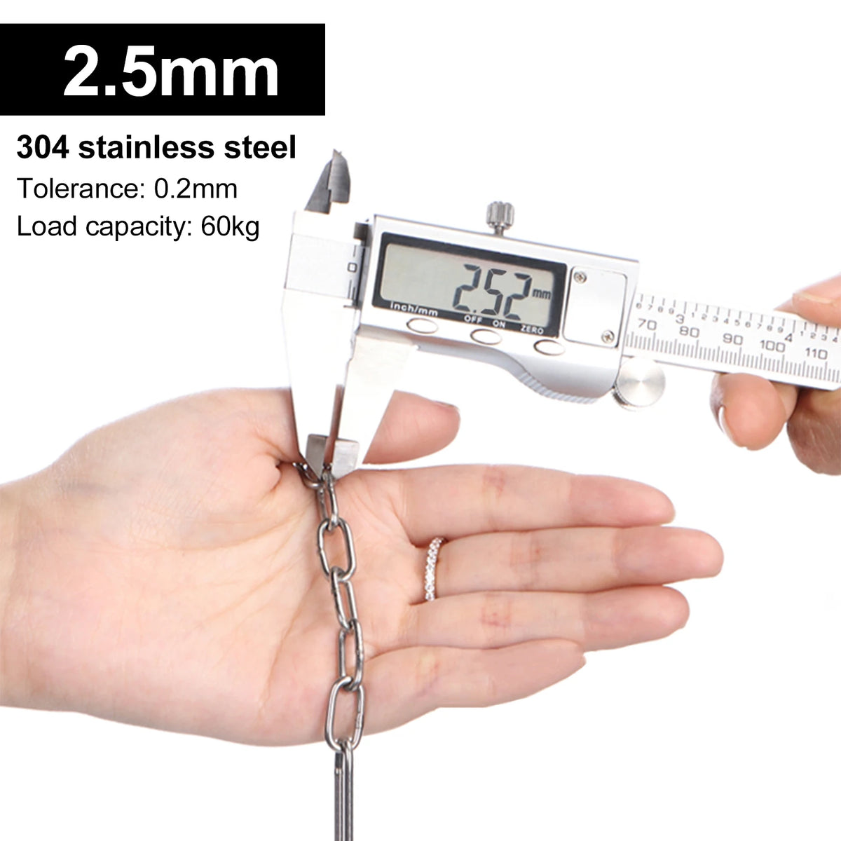 A hand holds a digital scale measuring a stainless steel chain, demonstrating its load capacity.