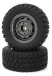 A black RC car receiver parts kit showing a tire and a separate rubber ring.