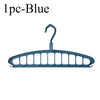 A single blue foldable multi-hole space-saving clothes hanger.