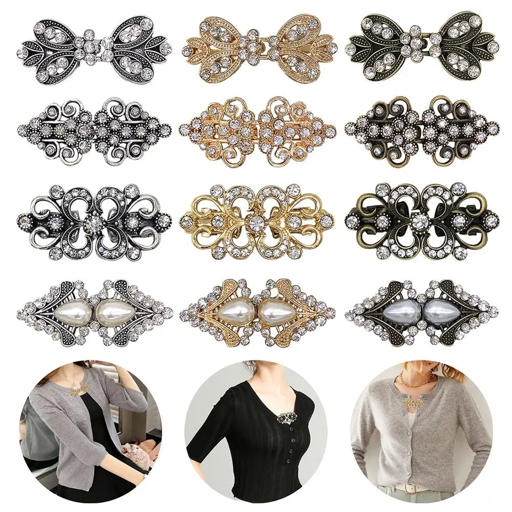A collection of vintage swirl sweater clips in silver and gold tones for decorating cardigans and shawls.
