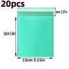 A transparent, light green padded bubble mailer with dimensions of 15cm x 13cm.