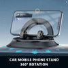A black 360 degree rotating car mobile phone stand with a silicone base shown on a dashboard.