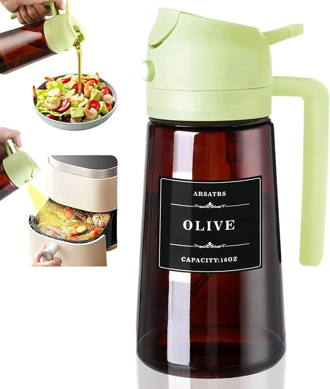 A green glass oil dispenser and sprayer is shown dispensing olive oil into a salad bowl.
