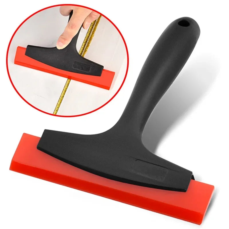 A black silicone scraper tool with a red rubber base is shown alongside an inset demonstrating its use.