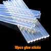 A bundle of 10 glue sticks is shown, arranged in a row on a dark surface.