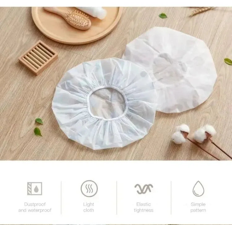 White waterproof shower cap for bathing and hair care shown on a wooden surface.