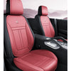 A pair of red leather car seat covers installed in a vehicle interior.