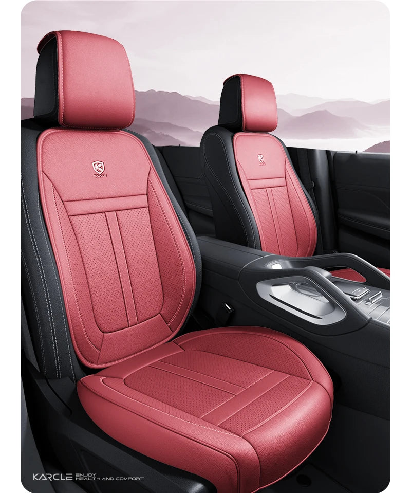 A pair of red leather car seat covers installed in a vehicle interior.