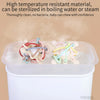 Silicone sensory rattle balls in various colors are shown inside a clear container, emphasizing sterilization and safety for 