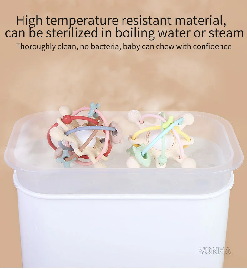 Silicone sensory rattle balls in various colors are shown inside a clear container, emphasizing sterilization and safety for 