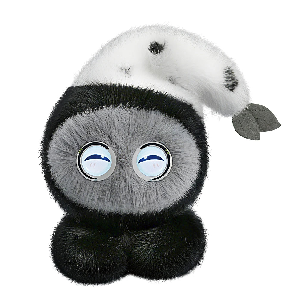 A plush robot resembling a seal or sea creature with gray and black fur and large, reflective eyes.